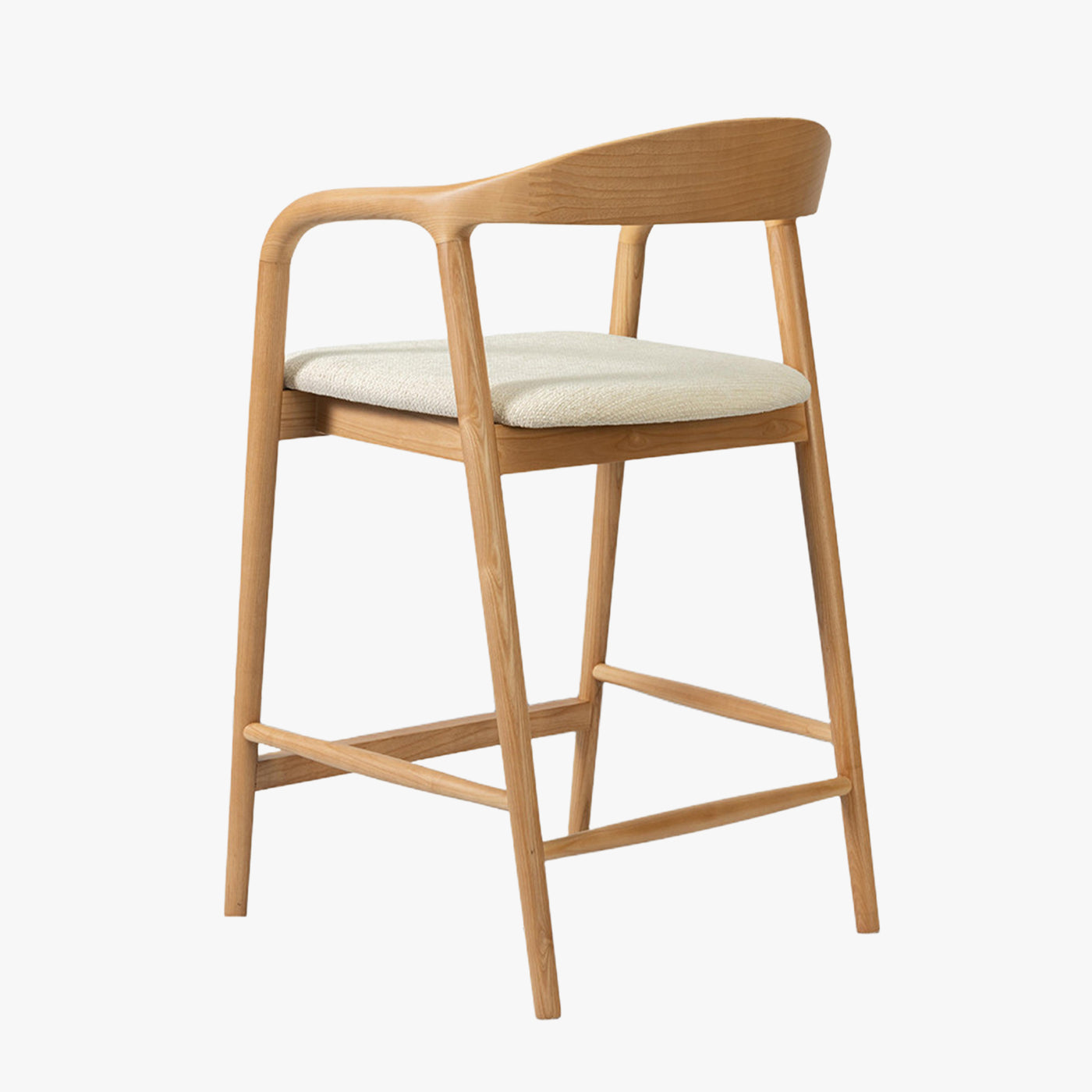 tabouret en tissu beige avec piètement en bois clair